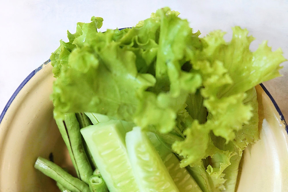 Some raw greens add a refreshing bite to your grilled pork.