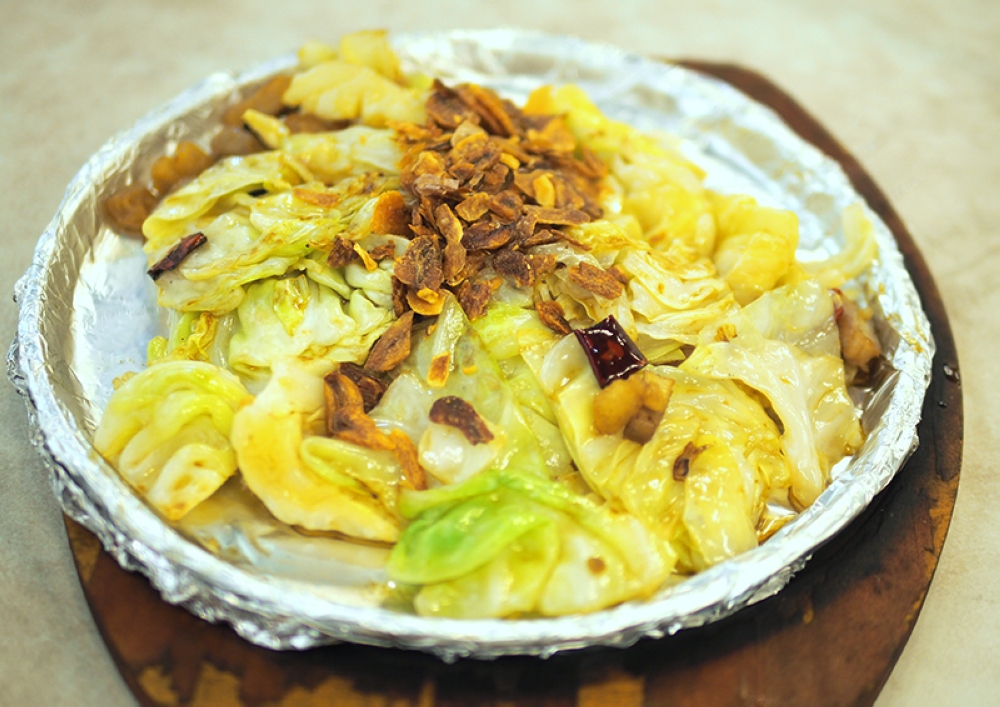 The Delicious Beijing Cabbage is a simple dish elevated by fried lard croutons