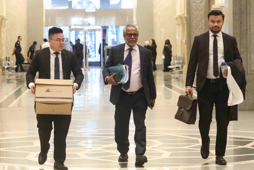 ​Datuk Seri Najib Razak’s lawyer, Tan Sri Muhammad Shafee Abdullah (centre) at the Palace of Justice in Putrajaya February 20, 2023. — Picture by Shafwan Zaidon