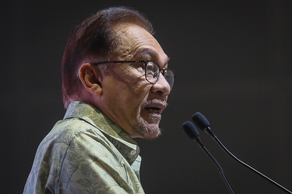 Prime Minister Datuk Seri Anwar Ibrahim delivers his speech during the Housewives Social Security Schemes and MyFutureJobs Career Fair at Kuala Lumpur Convention Centre February 10, 2023. — Picture by Yusof Mat Isa