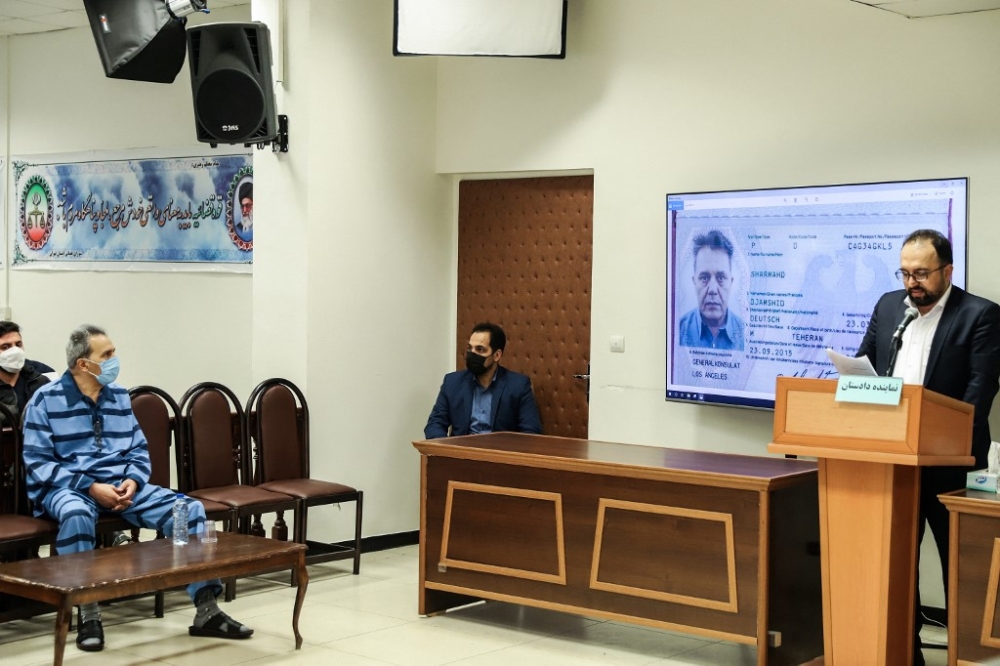 In this file photo taken on February 6, 2022, Jamshid Sharmahd (front left), who is accused by the Iranian government of being a leader of the US-based ‘Tondar terrorist group’ behind a deadly attack in Iran in 2008, attends the first hearing of his trial in Tehran. Iran on February 21, 2023, sentenced Sharmahd to death ‘on charge of corruption on earth through planning and directing terrorist acts,’ the Judiciary's Mizan Online agency reported. — AFP pic