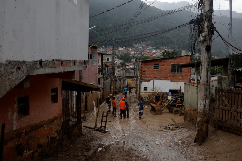 People work to remove mud after landslides in Sao Sebastiao, Brazil February 23, 2023. ― Reuters pic