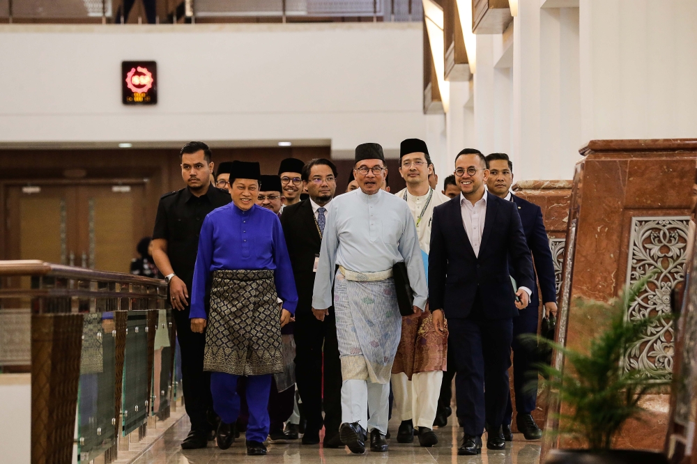 Prime Minister Datuk Seri Anwar Ibrahim (centre) arrives at the Parliament to table Budget 2023, in Kuala Lumpur February 24, 2023. — Picture by Sayuti Zainudin