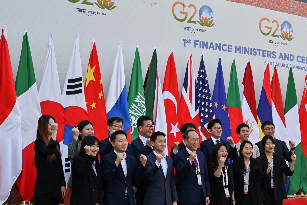 Delegation from South Korea pose for a photograph after coming out of the G20 Finance meetings under India’s G20 Presidency in Bengaluru on February 25, 2023. — AFP pic