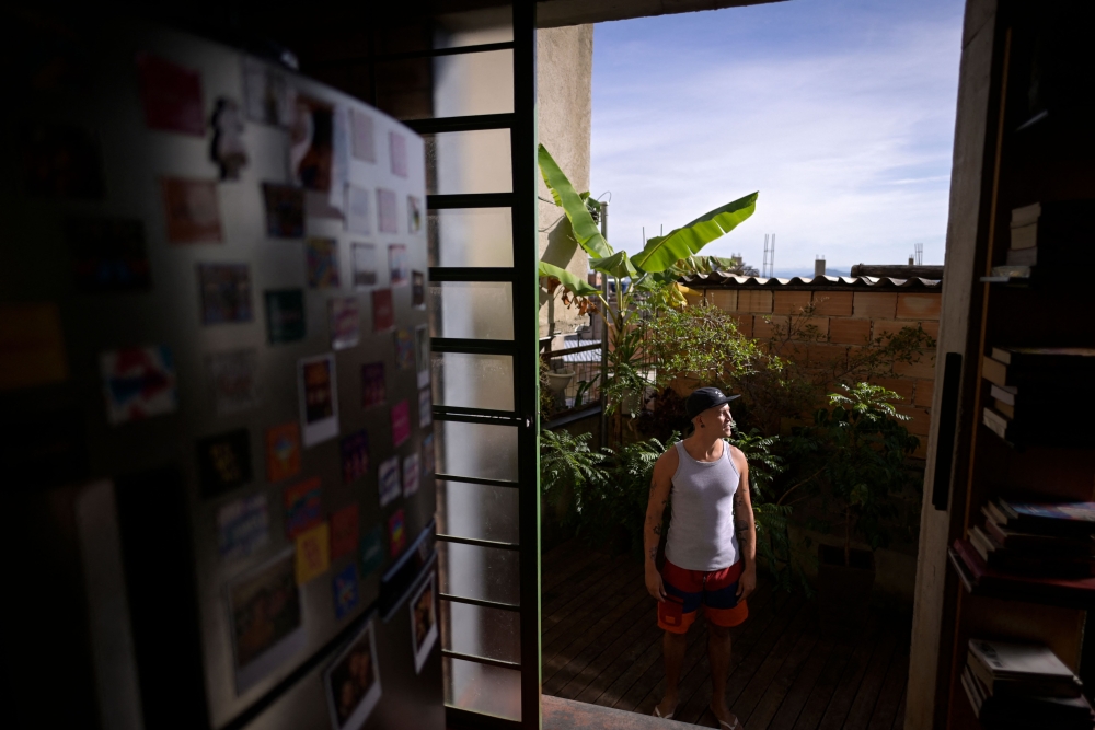 Brazilian musical artist Kdu dos Anjos looks on at his house. — AFP pic