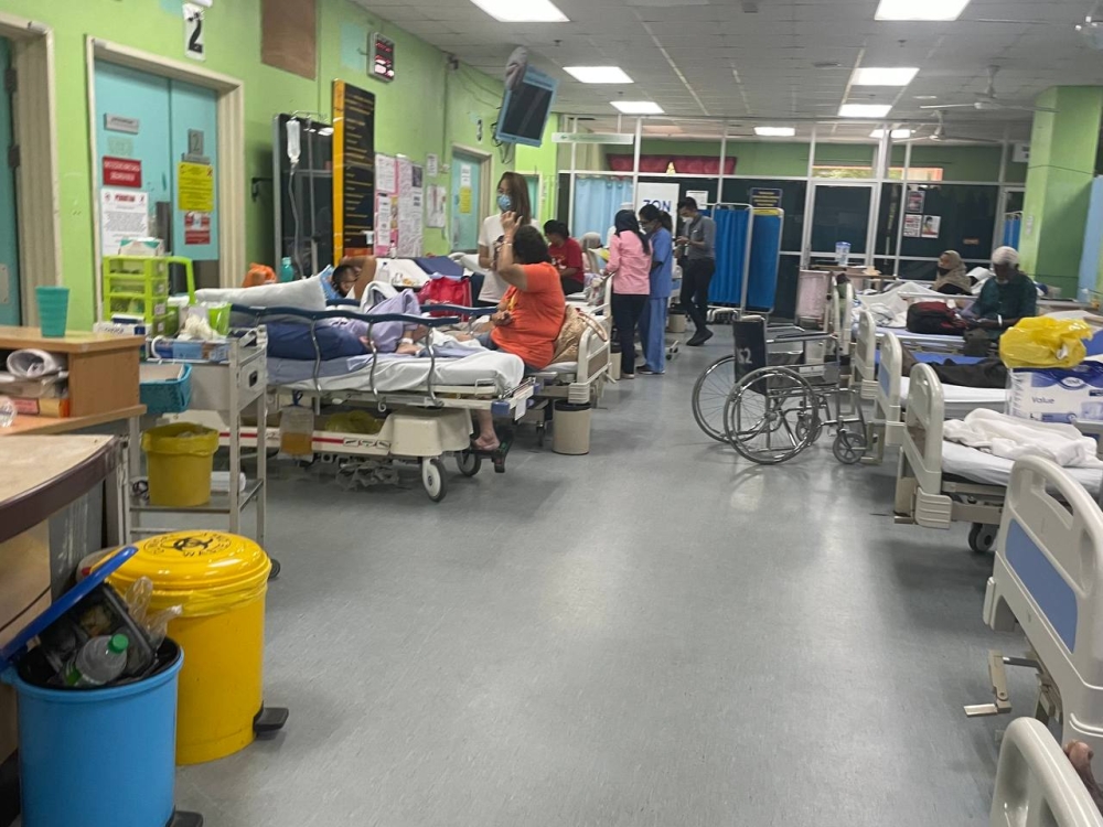 The green zone of Selayang Hospital's emergency department seen occupied by patients and their family members during the afternoon of February 16, 2023. — Picture by Rex Tan