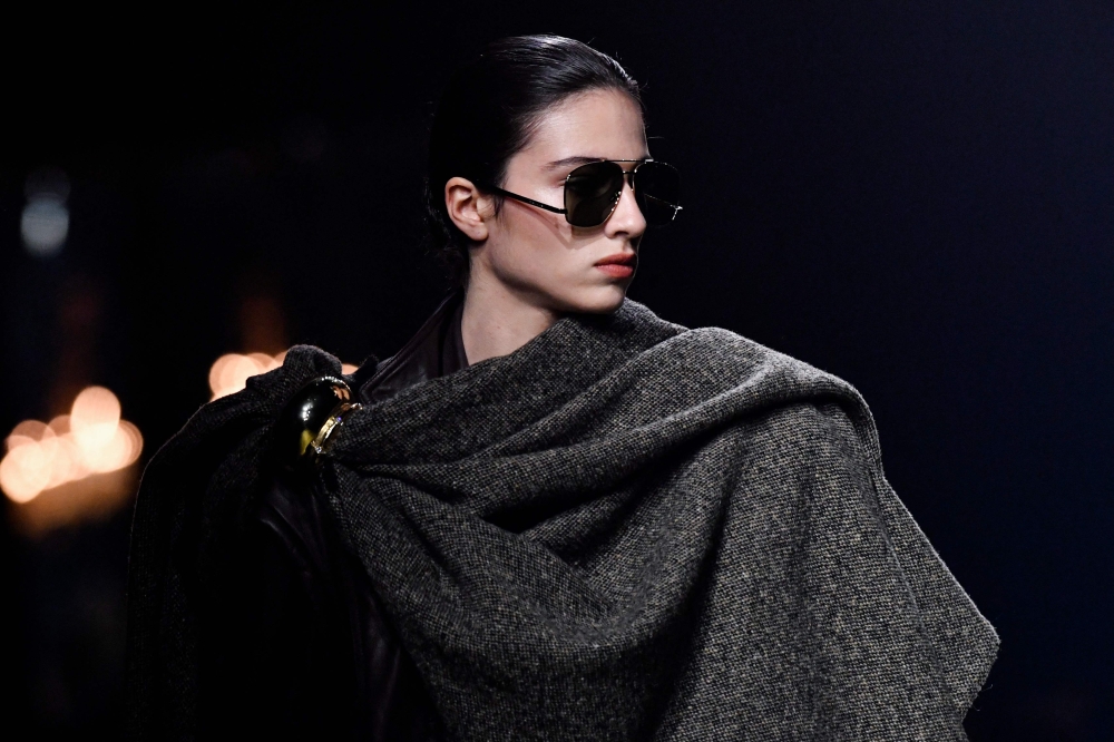 A model presents a creation from Saint Laurent Womenswear Fall-Winter 2023-2024 collection during Paris Fashion Week in Paris February 28, 2023. — AFP pic