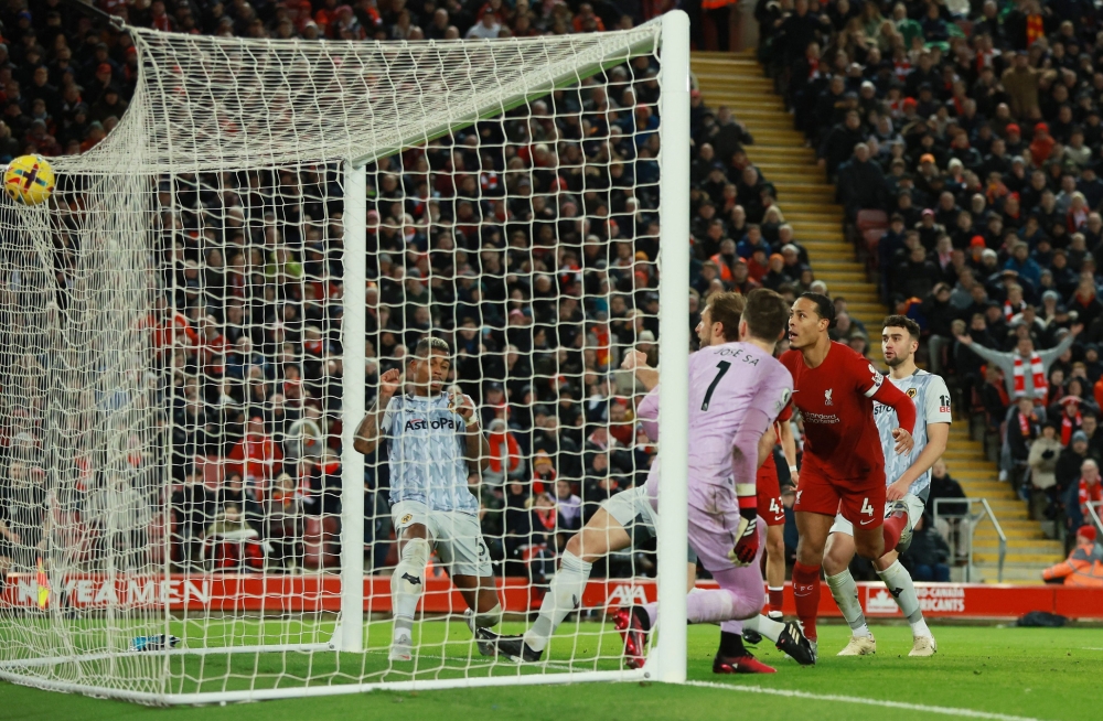 Virgil van Dijk and forward Mohamed Salah scored second-half goals as Liverpool battled to a 2-0 Premier League home win over Wolverhampton Wanderers yesterday. — Reuters pic