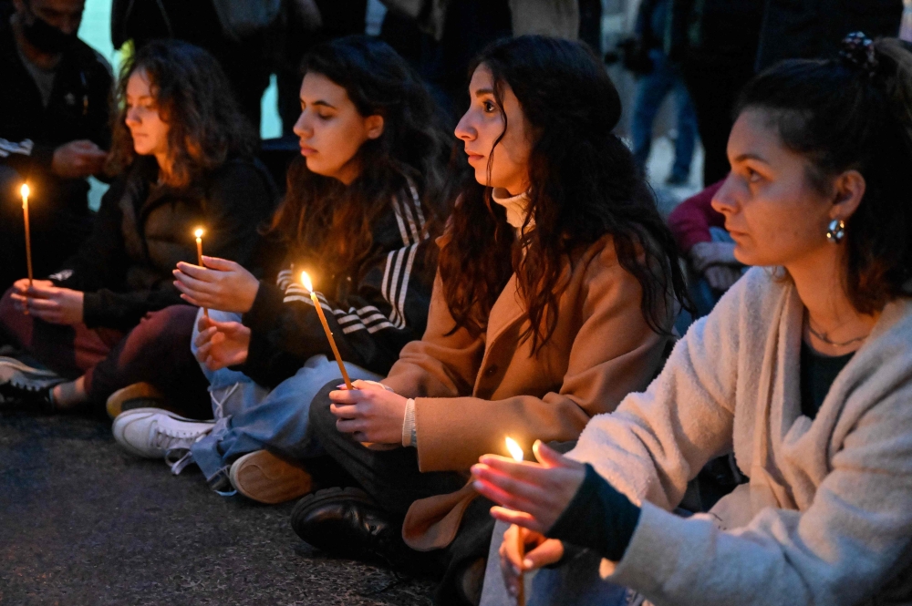 Students during a tribute to the victims. — AFP pic