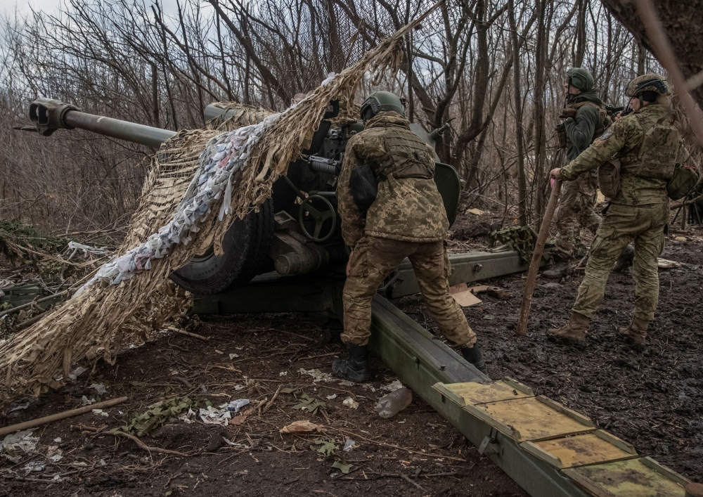 Ukrainian service members prepare to shoot from a howitzer at a front line, as Russia's attack on Ukraine continues, near the city of Bakhmut, Donetsk region, Ukraine March 2, 2023. — Reuters pic