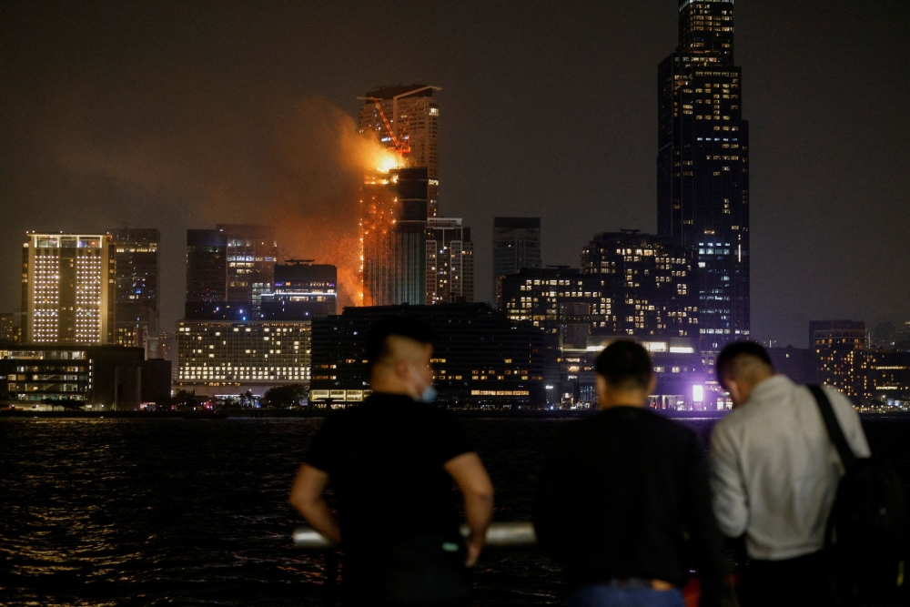 A building is seen on fire in Hong Kong March 3, 2023. — Reuters pic