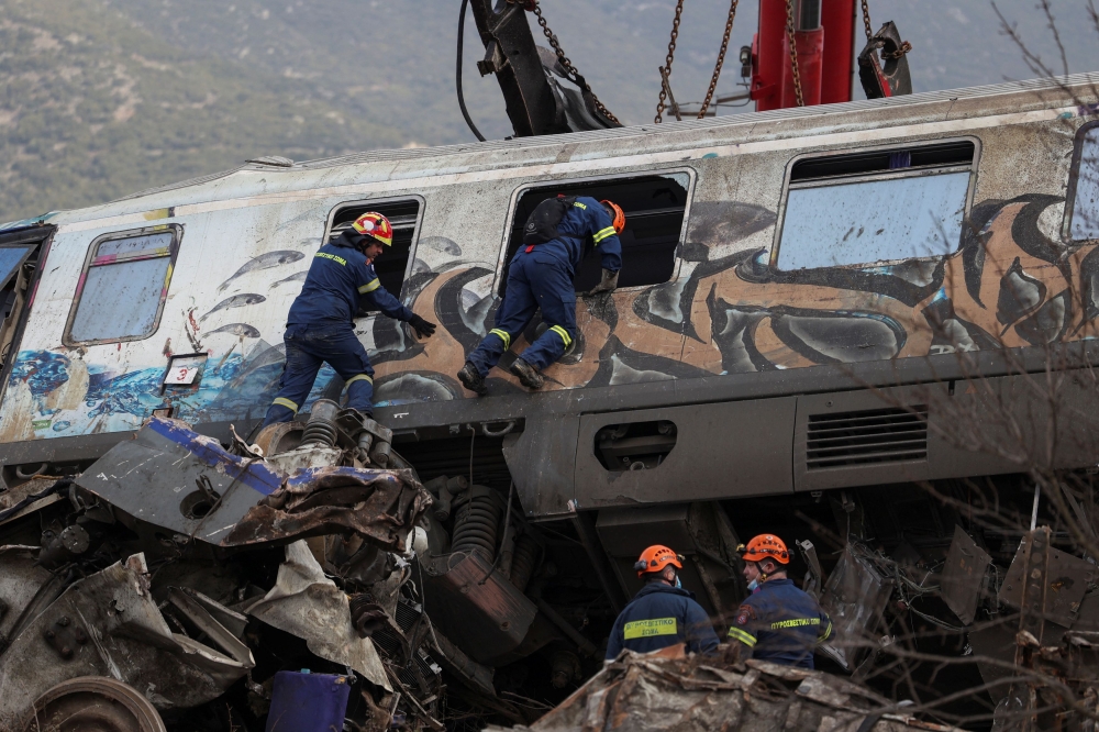 Rescuers operate at the site of the crash. — Reuters pic