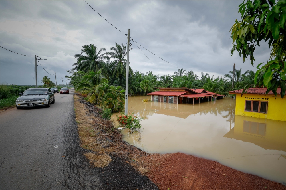 A view of flood-hit homes in Kampung Paris Penghulu Benteng located near the Rambai River in Jasin March 3, 2023. — Bernama pic