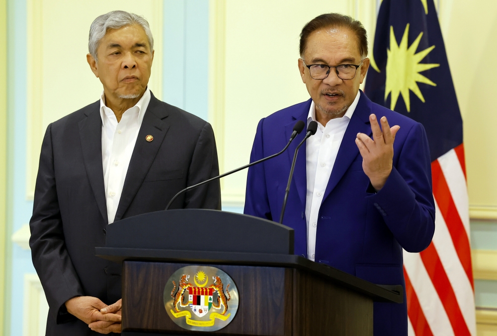 Prime Minister Datuk Seri Anwar Ibrahim (right) and Deputy Prime Minister Datuk Seri Ahmad Zahid Hamidi during a press conference after chairing the Cabinet meeting in Putrajaya February 8, 2023. — Bernama pic