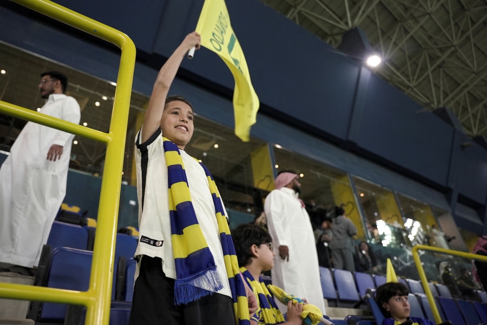 Syrian boy Nabil Saeed, who achieved his dream of meeting Al-Nasr's Cristiano Ronaldo, cheers for Al-Nasr during a match between Al-Nasr and Al-Batin, in Marsool Park Stadium in Riyadh, Saudi Arabia, March 3, 2023. — Reuters pic