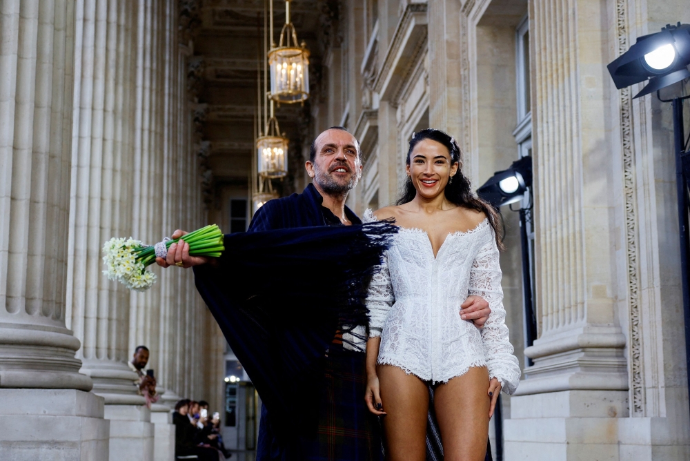 Designer Andreas Kronthaler poses with Westwood’s granddaughter Cora Corre after his Fall-Winter 2023/2024 Women's ready-to-wear collection show for late designer Vivienne Westwood's namesake label during Paris Fashion Week in Paris, France March 4, 2023. — Reuters pic