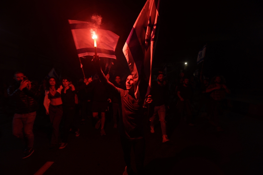 Dozens of Israeli air force reservists said yesterday they would not turn up for a training day in protest against Prime Minister Benjamin Netanyahu’s judicial reforms, a jolt for a country whose melting-pot military is meant to be apolitical. — AFP pic