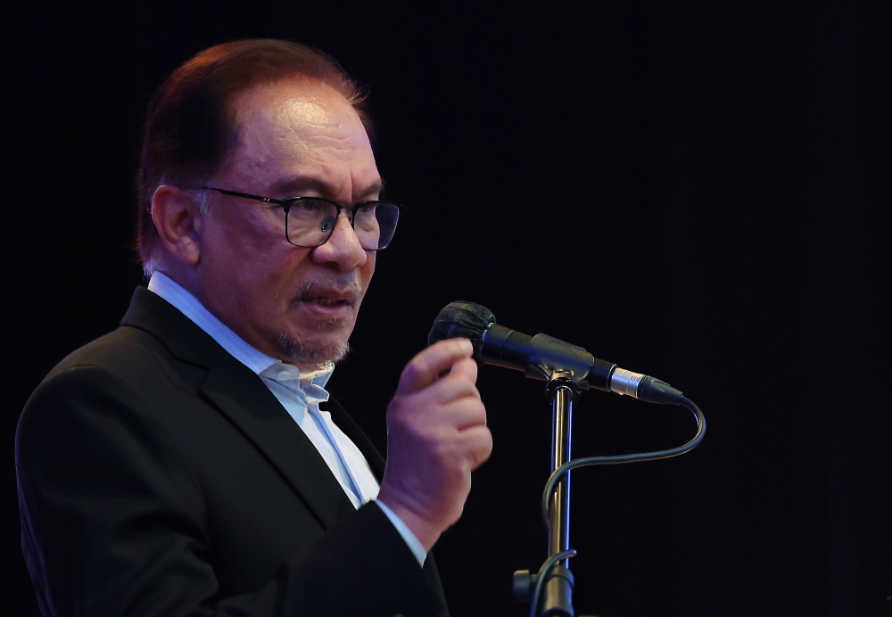 Prime Minister Datuk Seri Anwar Ibrahim, who is also finance minister, delivers his speech during the Finance Ministry’s monthly assembly in Putrajaya March 7, 2023. — Bernama pic