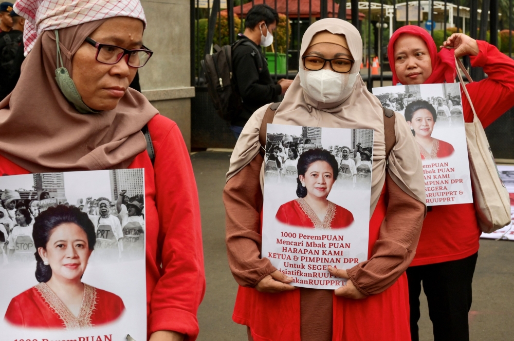 Marches took place on Wednesday Indonesia, where a few dozen women gathered in front of the country’s parliament to urge lawmakers to pass a long-awaited bill to protect domestic workers and some chanted ‘long live Indonesian women’. — AFP pic