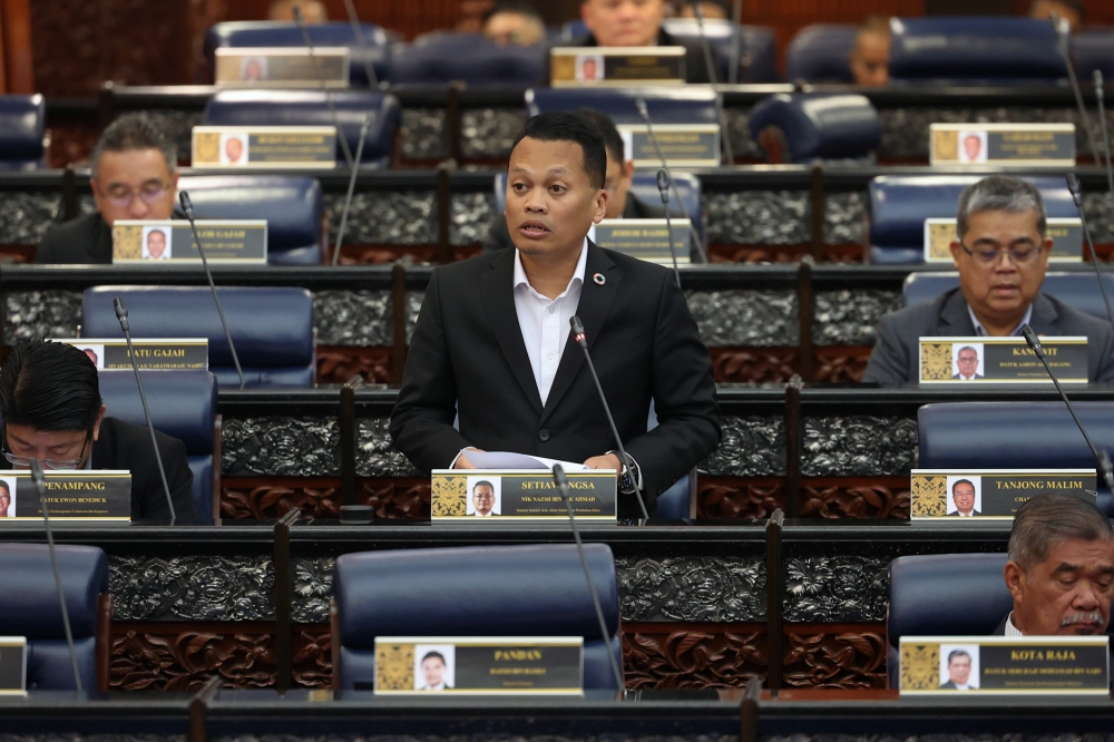 Minister of Natural Resources, Environment and Climate Change Nik Nazmi Nik Ahmad during a question and answer session at the Dewan Rakyat meeting in Parliament Building March 8, 2023. — Bernama pic