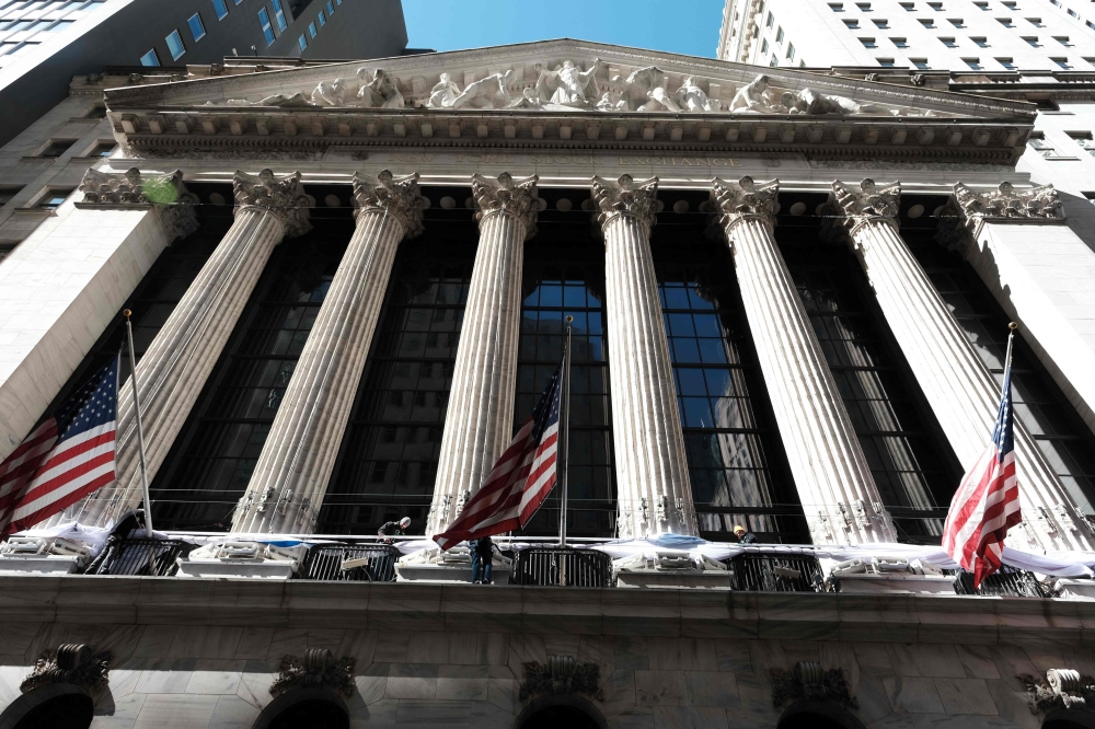 Stocks tread water after shock over Powell rate warning | Malay Mail