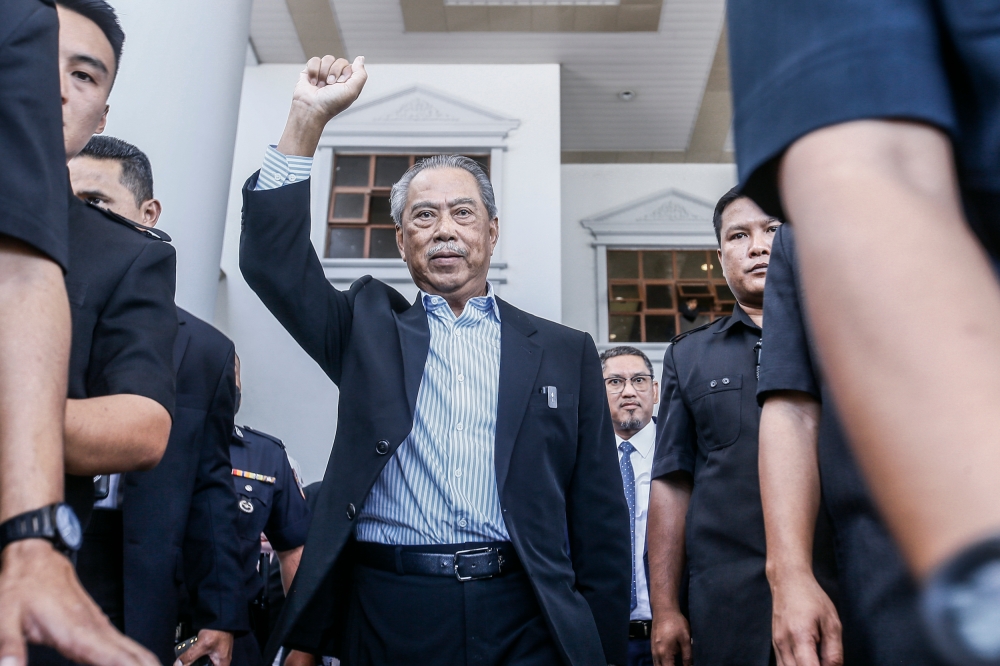 Former prime minister Tan Sri Muhyiddin Yassin leaves the Kuala Lumpur High Court Complex March 10, 2023. — Picture by Hari Anggara