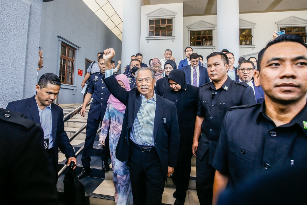 Former Prime Minister Tan Sri Muhyiddin Yassin leaves the Kuala Lumpur High Court complex March 10, 2023. — Picture by Hari Anggara