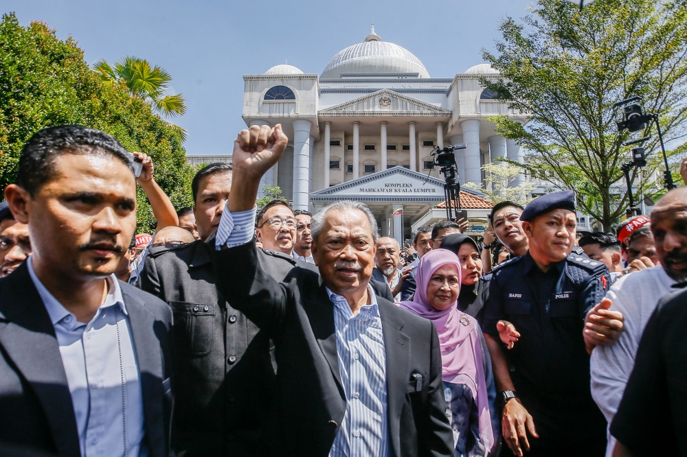 Former prime minister Tan Sri Muhyiddin Yassin leaves the Kuala Lumpur High Court Complex March 10, 2023. — Picture by Hari Anggara