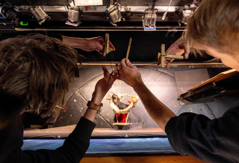 Puppeteers perform during the Snow White fairytale puppet show at the Unesco recognized Salzburg Marionette Theatre. — AFP pic