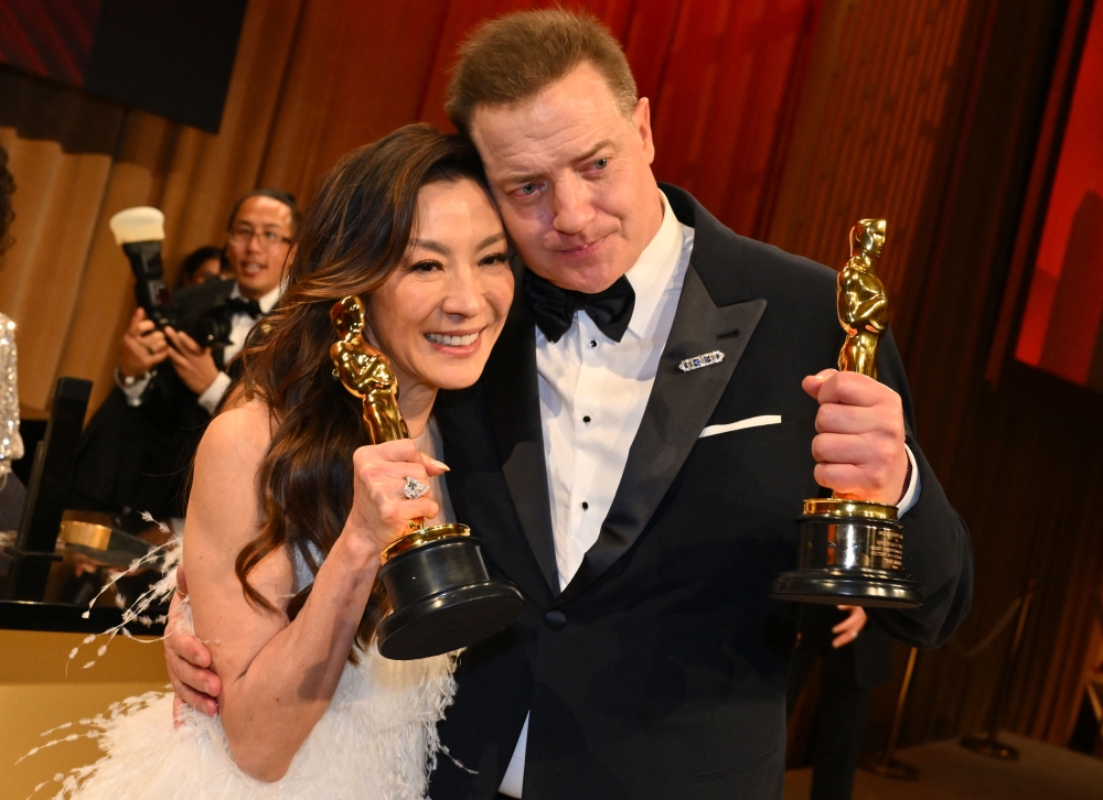 Malaysian actress Michelle Yeoh, winner of the Oscar for Best Actress in a Leading Role for ‘Everything Everywhere All at Once’ and US actor Brendan Fraser, winner of the Oscar for Best Actor in a Leading Role for ‘The Whale’. — AFP pic