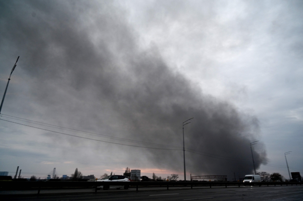 Smoke billows after a Russian missile strike in Kyiv on March 9, 2023. — AFP pic