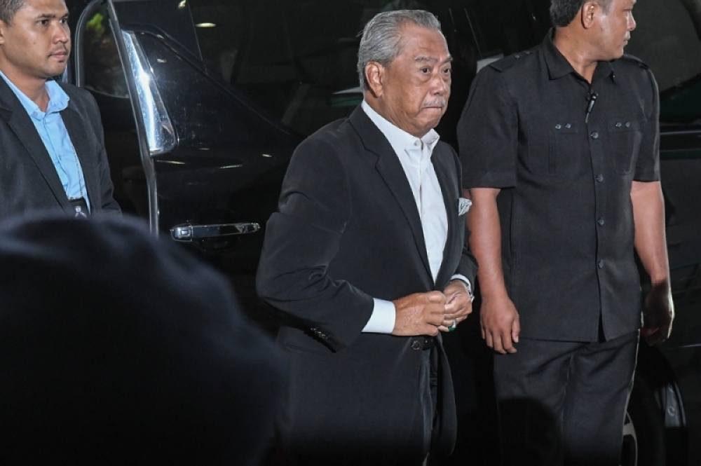 Former prime minister, Tan Sri Muhyiddin Yassin arrives at Shah Alam court on March 13, 2023. — Picture by Miera Zulyana