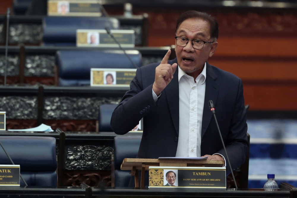 Prime Minister and Finance Minister Datuk Seri Anwar Ibrahim speaks at the Parliament in Kuala Lumpur March 14, 2023. — Bernama pic