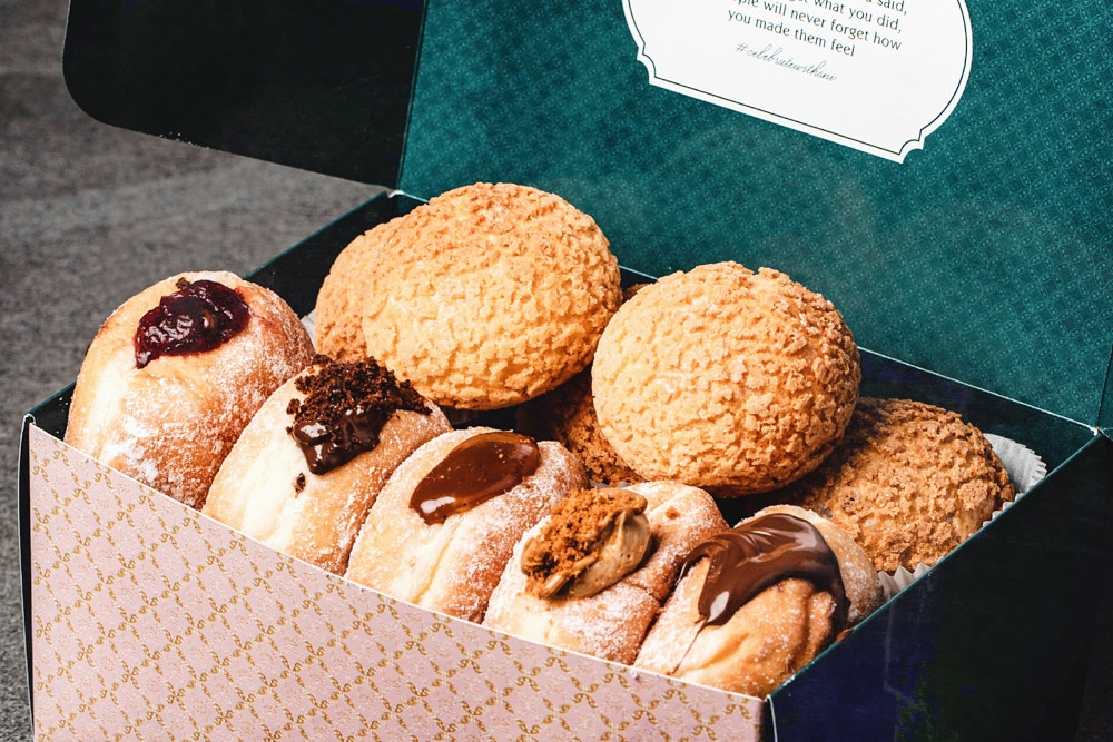 Sugar and I will have Boxes of Happiness for Raya, which includes 'bomboloni', cream puffs and drinks. — Picture courtesy of Sugar and I