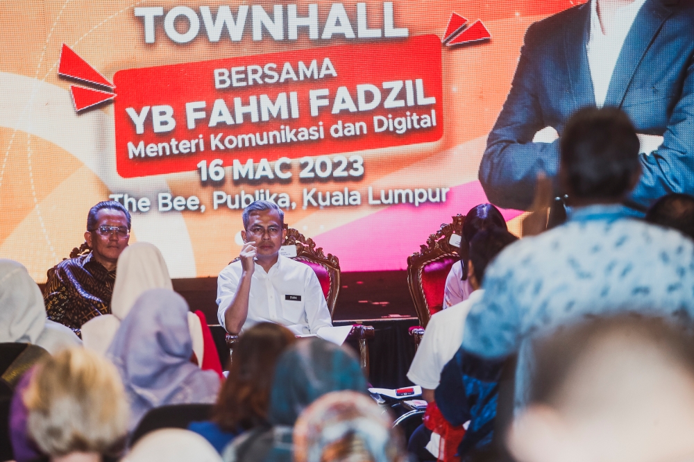 Communications and Digital Minister Fahmi Fadzil (centre) listens during a town hall meeting with concert organisers and arts groups at the Publika in Kuala Lumpur on March 16, 2023. — Picture by Hari Anggara