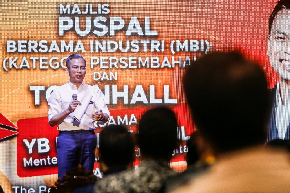 Communications and Digital Minister Fahmi Fadzil gives his speech during the Central Agency for the Application of Filming and Performance by Foreign Artistes (Puspal) town hall meeting at The Bee, Publika March 16, 2023. — Picture by Hari Anggara
