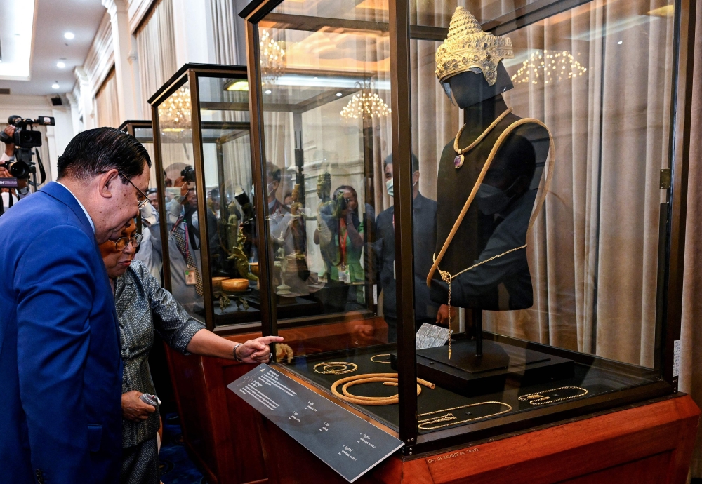 Cambodian leader Hun Sen unveiled a collection of stolen Angkor crown jewellery today which was recently returned to the kingdom after decades in Britain, pleading for other long-lost treasures to be handed back. — AFP pic