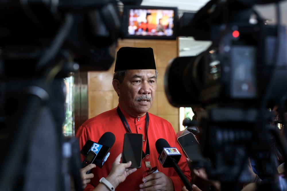 Umno deputy president Datuk Seri Mohamad Hasan speaks to reporters while attending the Rembau Umno Division delegates meeting in Seremban March 18, 2023. — Bernama pic