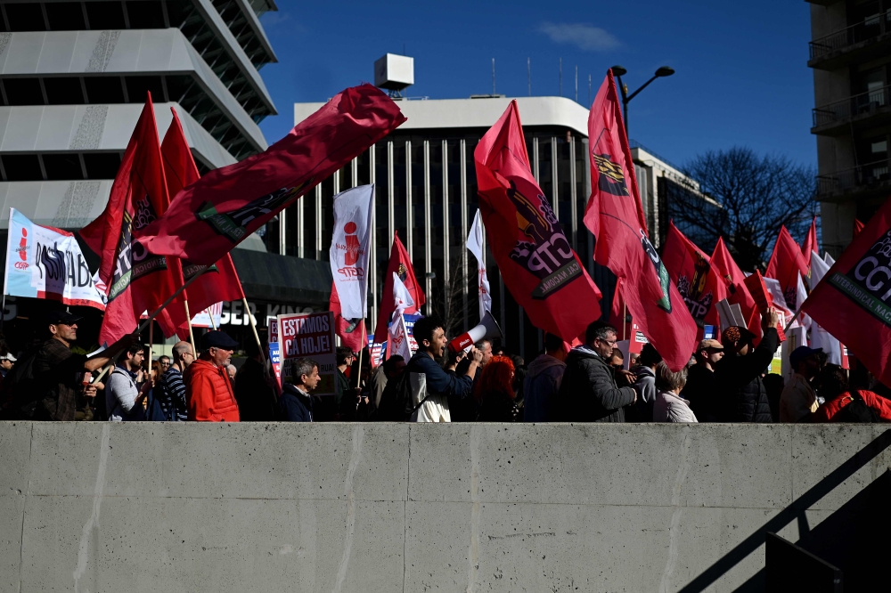 Thousands of protesters filled downtown Lisbon yesterday to demand higher wages and pensions, as well as government intervention to cap soaring food prices they say are strangling already tight budgets. — AFP pic