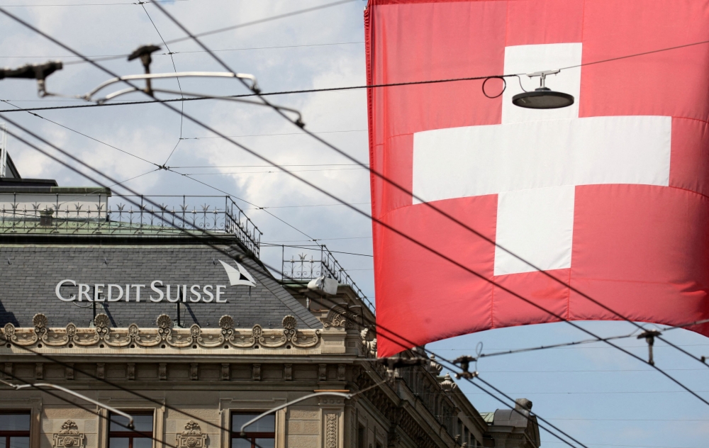 Talks over rescuing Credit Suisse rolled into Sunday as UBS AG sought US$6 billion from the Swiss government to cover costs if it were to buy its struggling rival. — Reuters pic