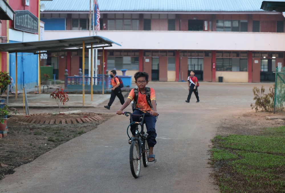Students are seen on the first day of school at Sekolah Kebangsaan Sri Gading, Parit Raja, Batu Pahat March 19, 2023. — Bernama pic