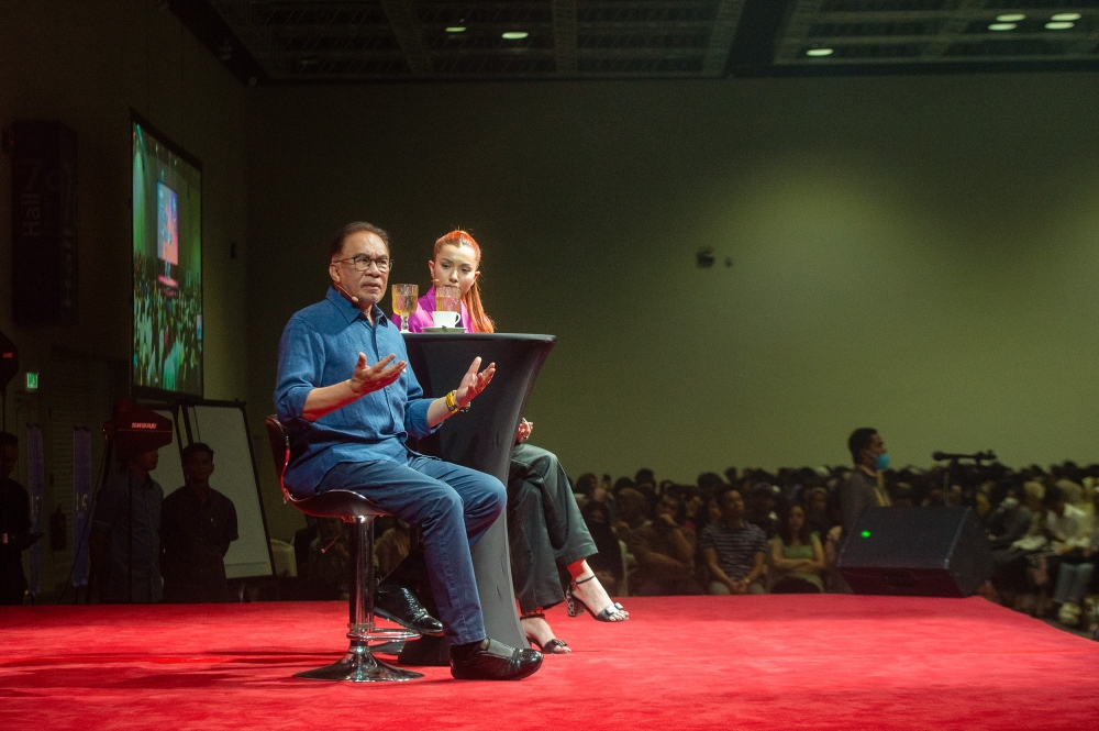 Prime minister Datuk Seri Anwar Ibrahim speaks during ‘Dialog Anak Muda Temu Anwar’ in conjunction with the Youth Empowerment Fair 2023 at the Kuala Lumpur Convention Centre March 19, 2023. — Picture by Shafwan Zaidon 