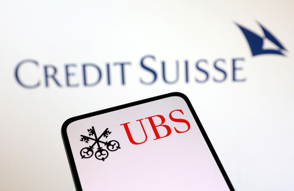 UBS Group and Credit Suisse logos are seen in this illustration taken March 18, 2023. — Reuters pic