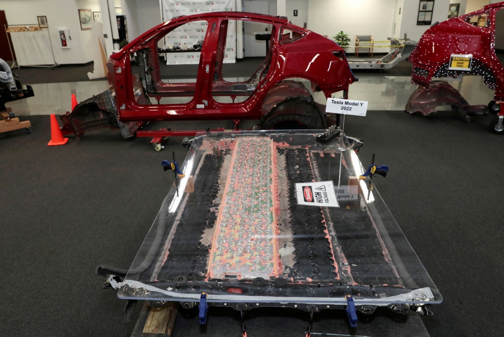 A partially disassembled 4680 structural battery pack from a Tesla Model Y. — Reuters pic