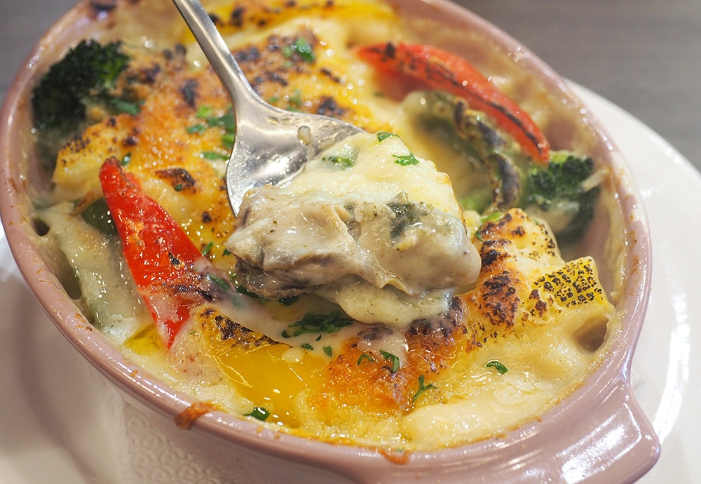 Dig inside the gratin for hidden treasure in the form of briny oysters.