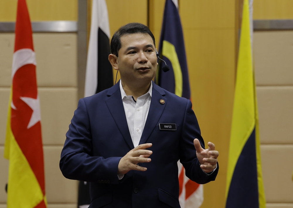 Economy Minister Rafizi Ramli says in order to implement the Universal Basic Income scheme, the country's fiscal position needs to be improved. — Bernama pic