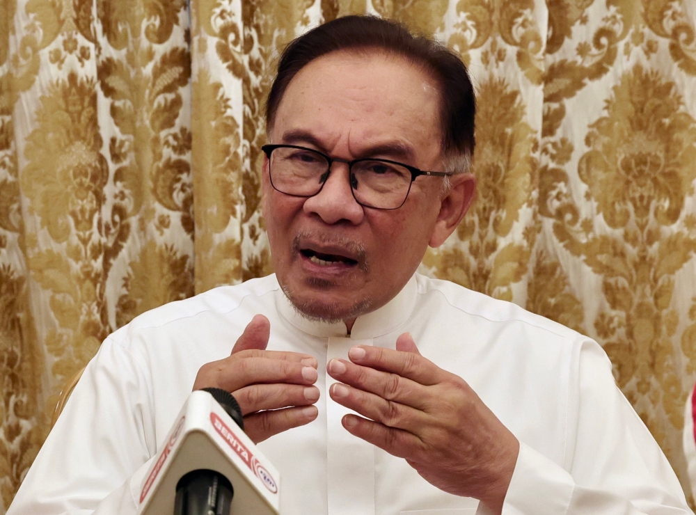 Prime Minister Datuk Seri Anwar Ibrahim holding a press conference after meeting with the Secretary General of the Organization of Islamic Cooperation (OIC) Hissein Brahim Taha in Mecca, March 22, 2023. — Bernama pic