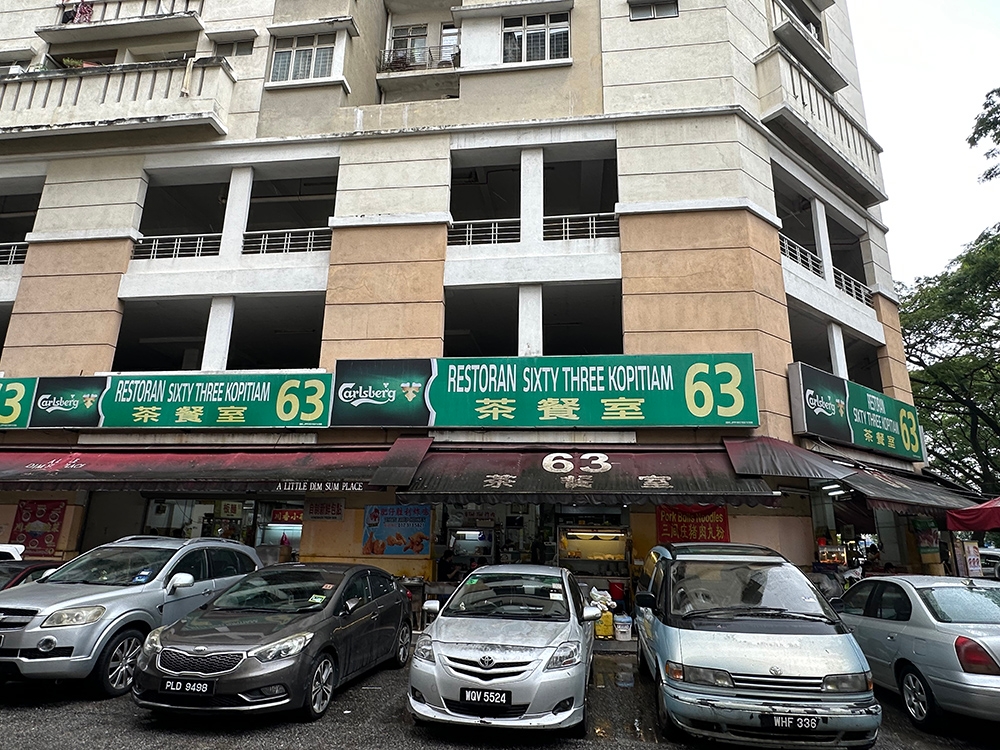 Look for this sign to the coffee shop that is packed with various stalls.