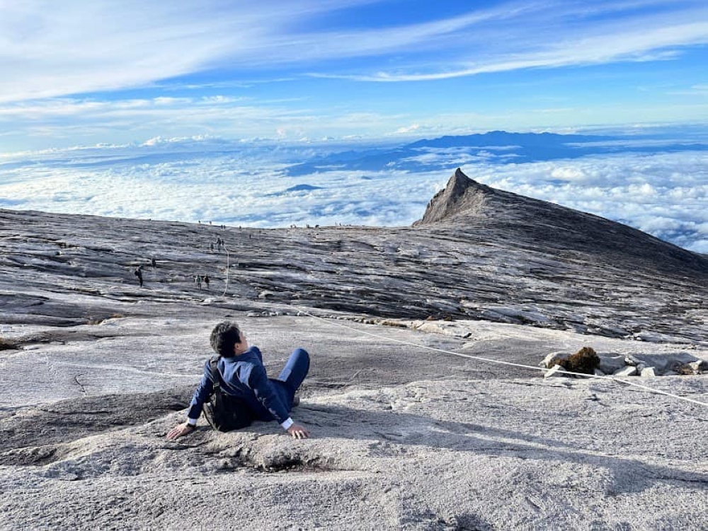 Sada takes in the view in his business meeting ready suit. — Picture via Facebook/Nobutaka Sada