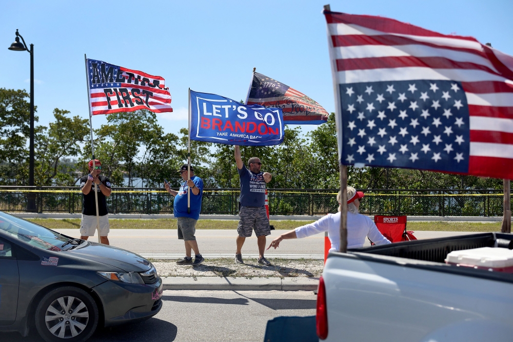 People show their support for former President Donald Trump near his Mar-a-Lago home in Palm Beach, Florida. — AFP pic